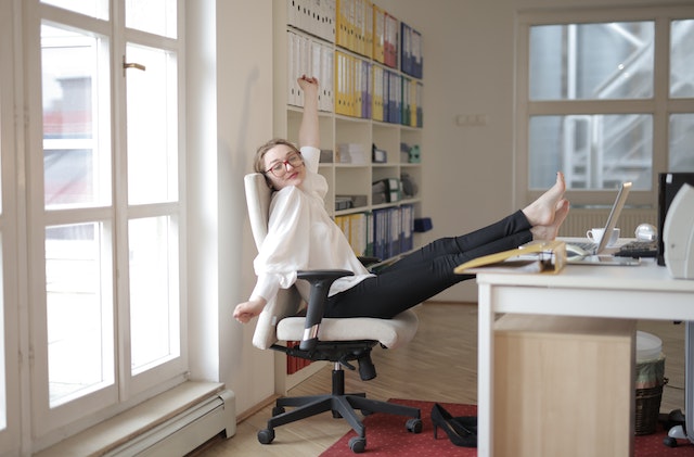 office woman with feet on desk